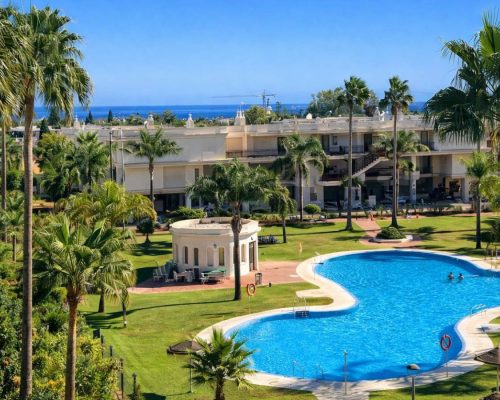 Luxury resort pools in Marbella with sunloungers and parasols